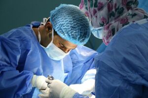 A dentist performing an examination, representing dental indemnity insurance